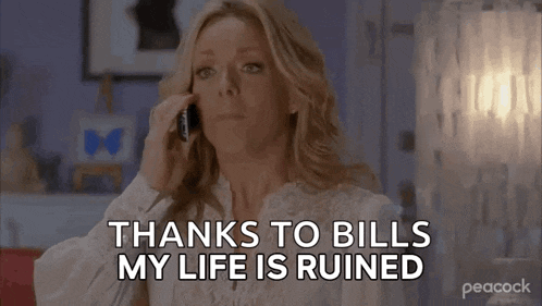 a woman is talking on a cell phone and saying `` thanks to bills , my life is ruined '' .