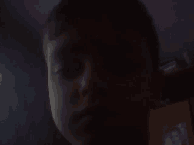 a close up of a child 's face with a purple background