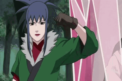 a cartoon girl with blue hair and a green jacket is standing in front of a pink wall .