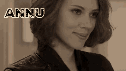 a close up of a woman 's face with the name annu written on it