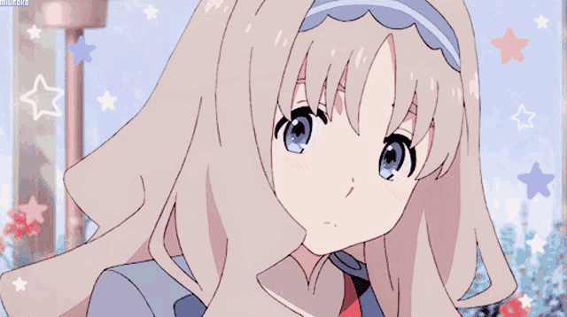 a girl with long blonde hair and blue eyes is surrounded by pink and blue stars