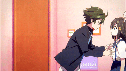a boy and a girl are standing next to each other in a room