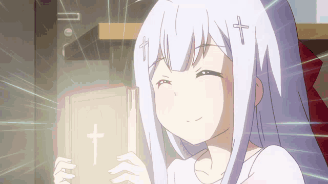 a girl holding a book with a cross on the cover