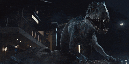 a large dinosaur is standing in front of a building with a sign that says ' a '
