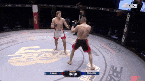 two men are fighting in a ring with the time 04:50 on the screen
