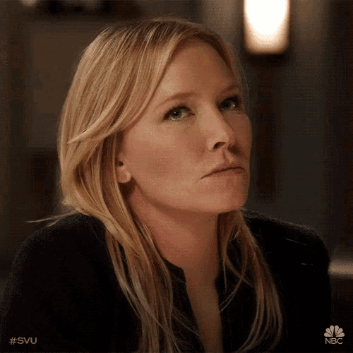 a close up of a woman 's face with the hashtag #svu on the bottom right