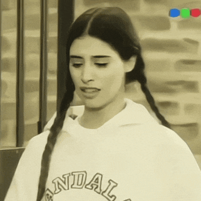 a woman with braids is wearing a sweatshirt with the word andal on it