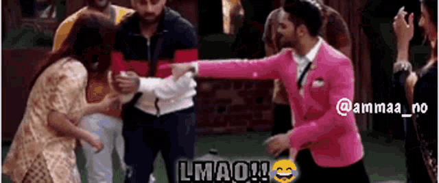 a man in a pink suit is pointing at a woman in a white dress