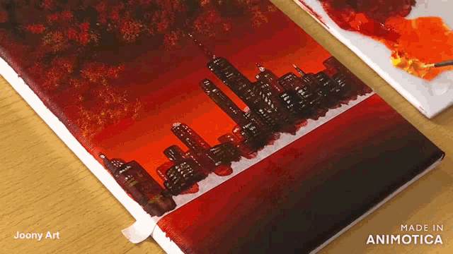 a painting of a city skyline is being made by joony art