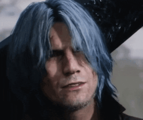 a close up of a man with blue hair and a beard .
