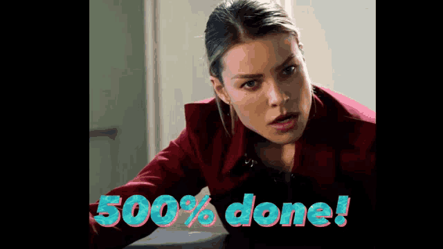 a woman in a red coat with the words 500 % done behind her
