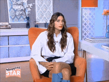 a woman sits in an orange chair with the words shopping star on the bottom right