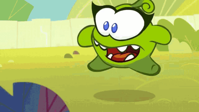 a green cartoon character with blue eyes is jumping in the air while wearing glasses