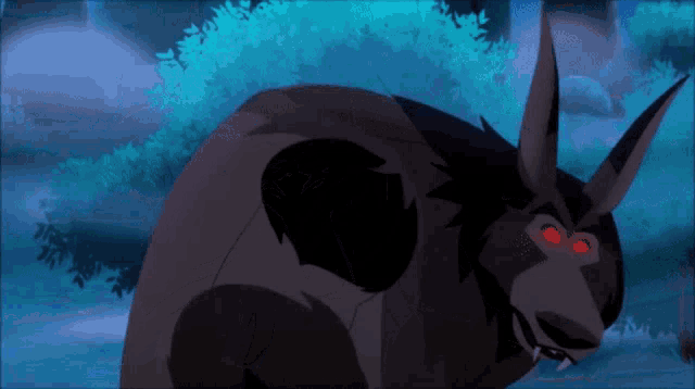 a cartoon character with red eyes is laying down