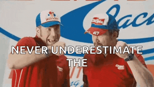 two men wearing hats are standing next to each other .