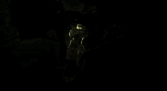 a spawn comic book character is surrounded by green lights