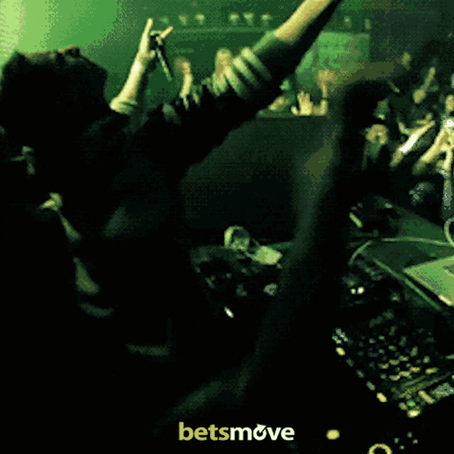 a man with his arms in the air behind a betsmove logo