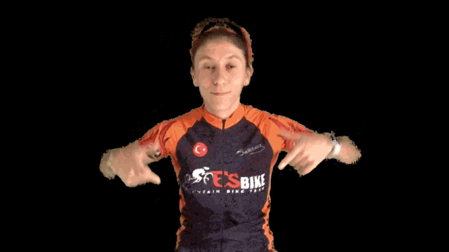 a woman wearing a shirt that says ' tcsbike ' on it