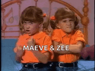 two little girls are standing next to each other with their arms crossed and the words maeve and zee written on the bottom .