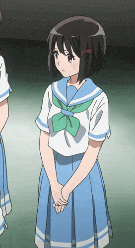 a girl in a blue and white school uniform with a green bow around her neck