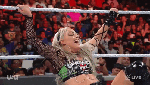 a woman in a wrestling ring with the word usa on the bottom