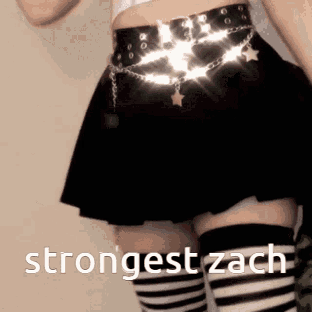 a woman wearing striped thigh high socks and a black skirt has the words strongest zach above her