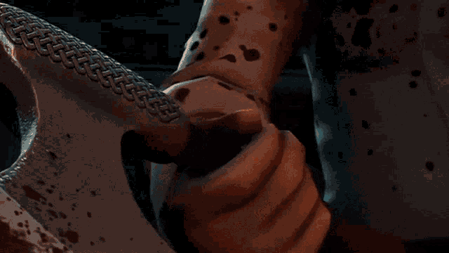 a close up of a cartoon character with blood on his face
