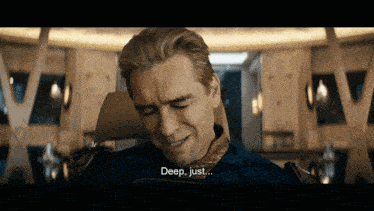 a close up of a man 's face with the words deep just below him