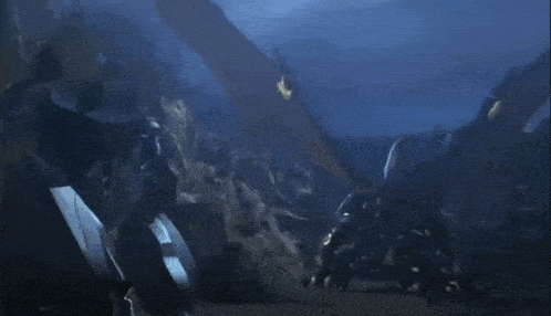 a dragon is flying over a rocky landscape at night