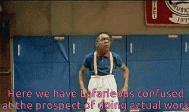 a man wearing glasses and a red scarf says " here we have lafarious confused at the prospect of doing actual work "