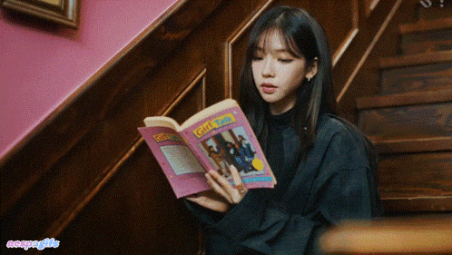 a girl is reading a book called girl scouts
