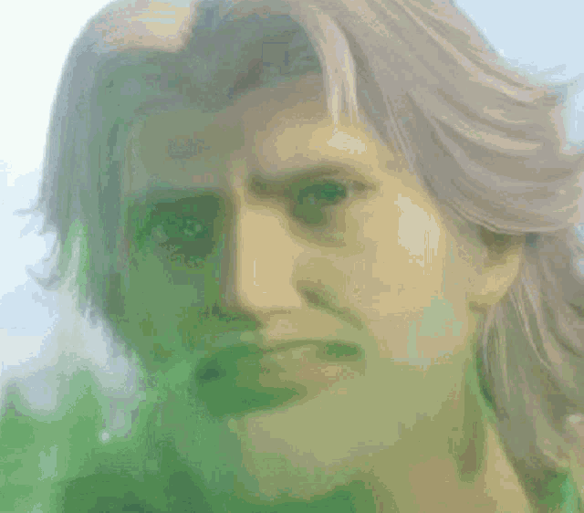 a close up of cloud strife 's face with a surprised look on his face