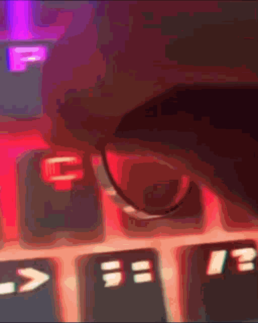 a close up of a person 's hand on a keyboard with the shift key in the foreground