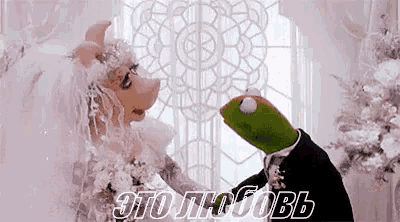 mrs. piggy and kermit the frog are getting married in a wedding dress .