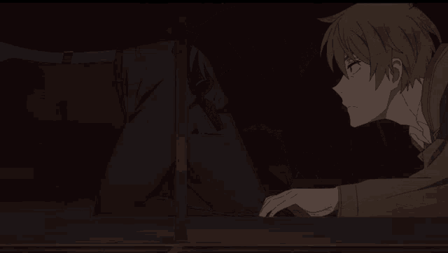 a man in a suit and tie is looking out a window