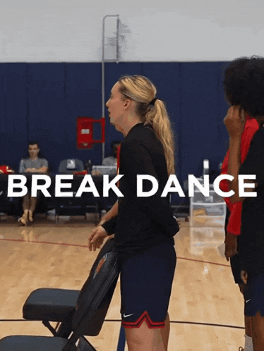 a woman standing on a basketball court with the words break dance written above her
