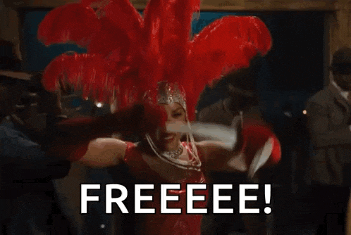 a woman in a red dress is holding a red feather boa over her head and saying `` freeeee '' .