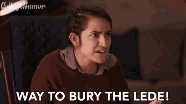a woman is sitting in a chair with the words `` way to bury the lede '' written on the screen .