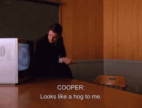 cooper looks like a hog to me while standing in front of a television