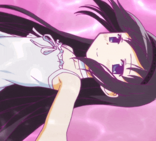 a girl with long black hair is laying down on a pink background