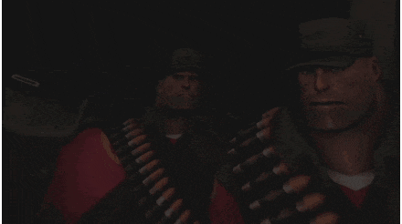 two soldiers are standing next to each other in the dark .