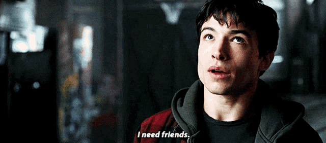 a man in a hoodie says i need friends in a dark room .