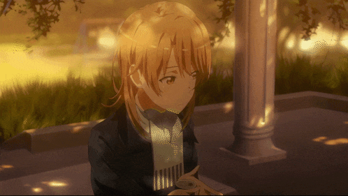 a girl with blonde hair is sitting in front of a white column