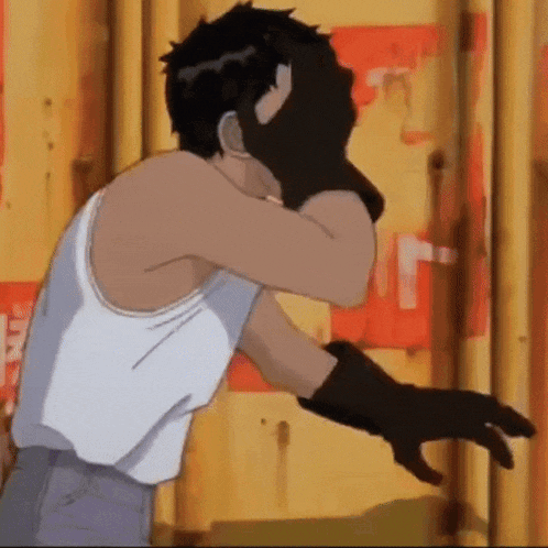 a man wearing a white tank top and black gloves is covering his face with his hand .
