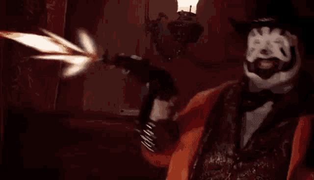 a clown in a cowboy hat and bow tie is holding a gun .