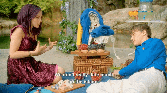 a man and a woman are having a picnic with the words we don t really date much on the island