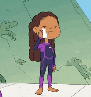 a cartoon girl in a purple wetsuit wipes her face with a towel .
