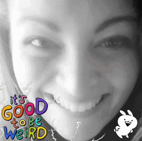 a woman 's face with the words it 's good to be weird behind her
