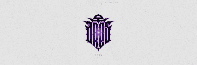 a purple and black logo on a white background that looks like a shield .