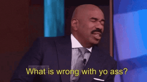 a man in a suit and tie says what is wrong with yo ass .